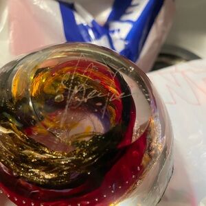 Artistic Glass Paperweight with Red and Gold Swirls